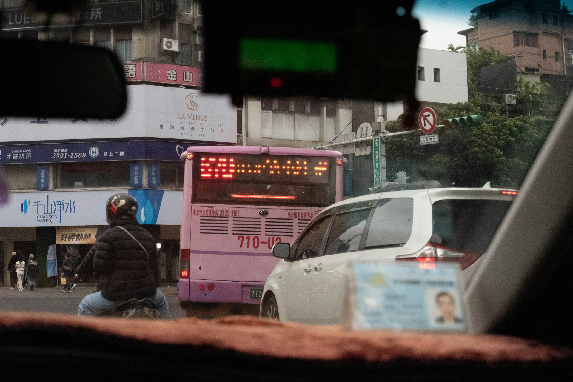Bus and cars in traffic on city street